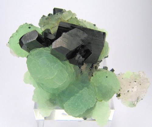 earthstory:
“ Babingtonite
While I normally share colourful and transparent minerals, I am personally fond of opaques, or those like this one that are so dark green that they appear black. For those who like colour and gemminess I selected a cluster...