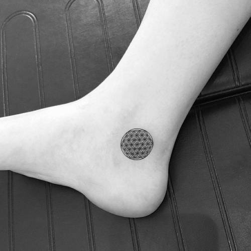 Flower of life tattoo on the ankle. Tattoo artist: Jon Boy ·... flower of life;geometric shape;small;jonboy;micro;black;of sacred geometry shapes;tiny;ankle;little;sacred geometry;geometric