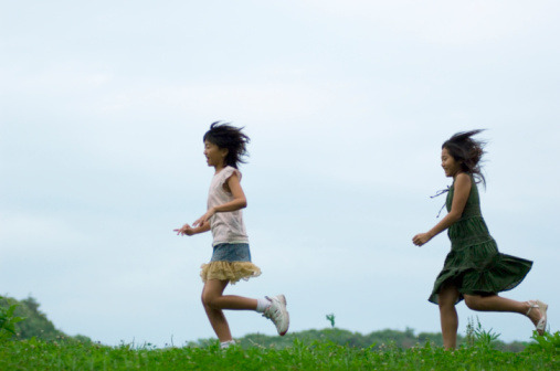 girls-running-grass
