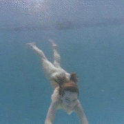 Redhead girl swimming