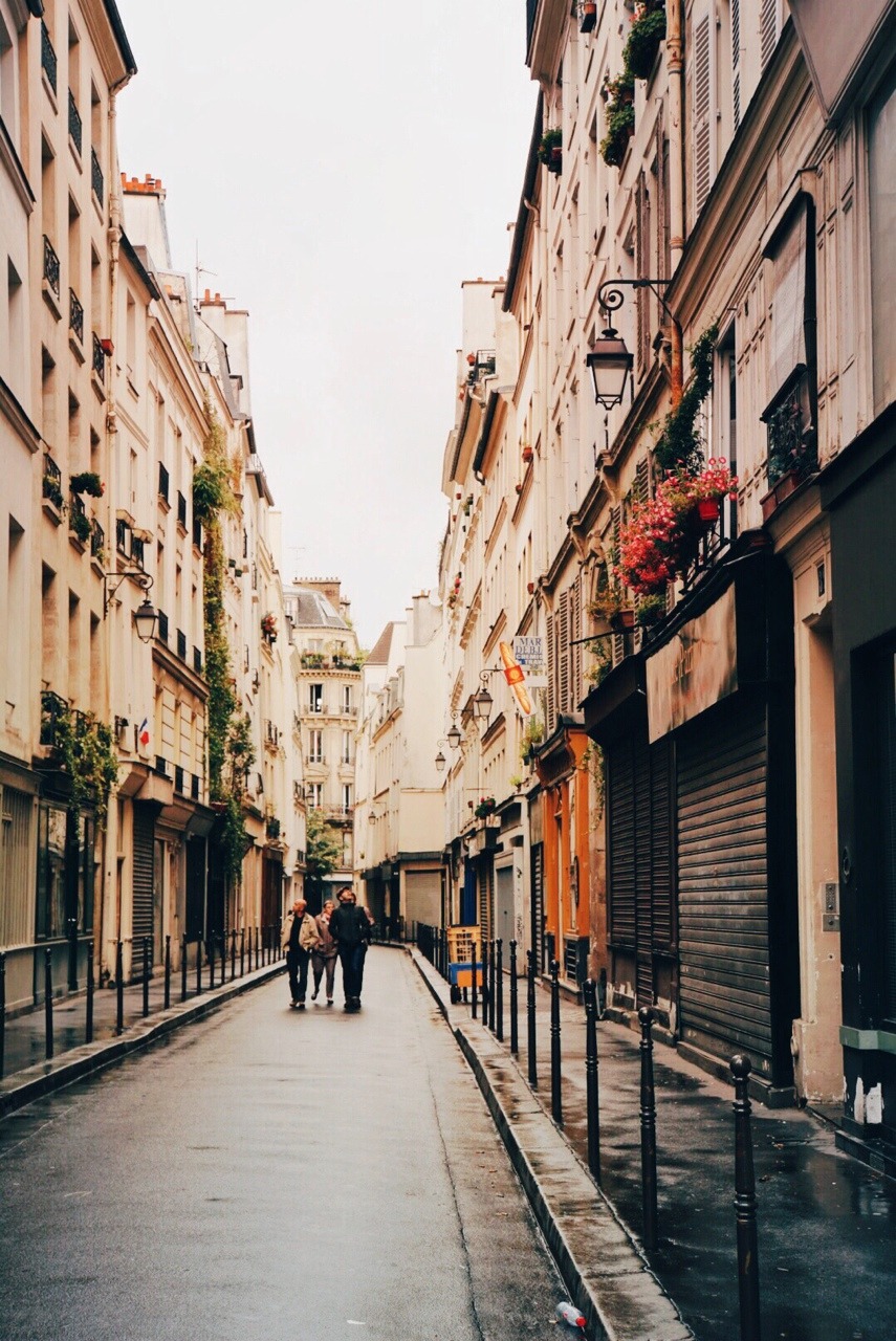 Paris - Streets Paris is a muse. She is best experienced in the rain. With her slick streets and her wild eyes framed by a well-kept exterior, she sweeps you off your feet. And you know immediately that you have fallen for her. Forever. —- View: My...